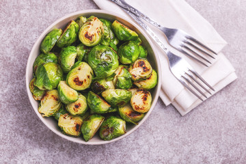 Vegetarian cuisine. Brussels Sprouts roasted with olive oil. Copyspace