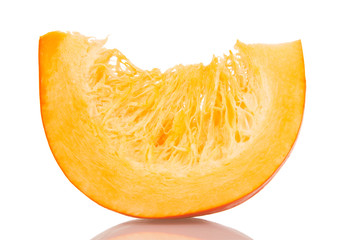 Juicy slice of ripe orange pumpkin, isolated on white
