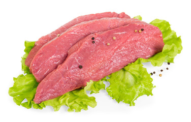 Pieces of fresh veal with spices and salad leaves isolated on white