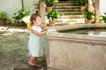 Cute small girl in Alfabia gardens