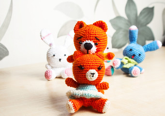 Fototapeta premium knitted toy cat, bear, rabbit, hare, handmade