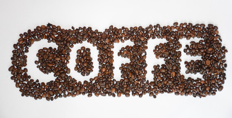 Inscription of coffee beans on white background.