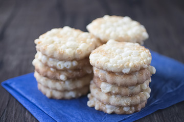 Cheese biscuits on blue paper.