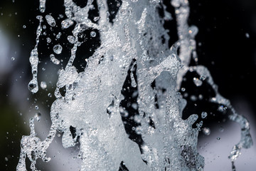 The gush of water of a fountain. Splash of water in the fountain, abstract image