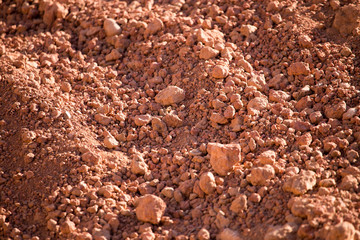 Red clay soil on nature as a background