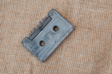 Background of audio cassette on burlap