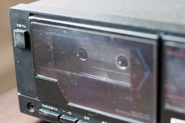 Background, old tape recorder with a cassette