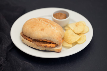 sandwich with meat  and potato on plate