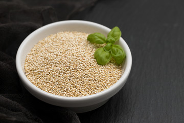 uncooked quinoa in white bowl