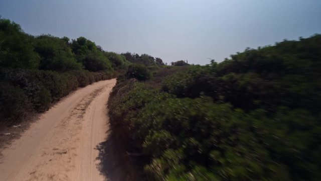 hyper lapse POV shot from a camera attached to the front of an off road vehicle driving through beautiful trails and paths in sardinia
