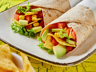 Delicious tortilla wraps with avocado and nachos