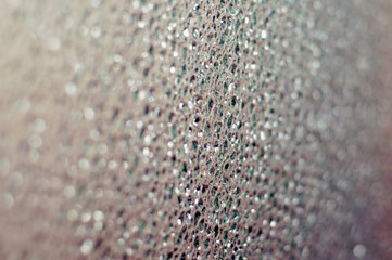 Gray abstract background of glass bokeh with space for text