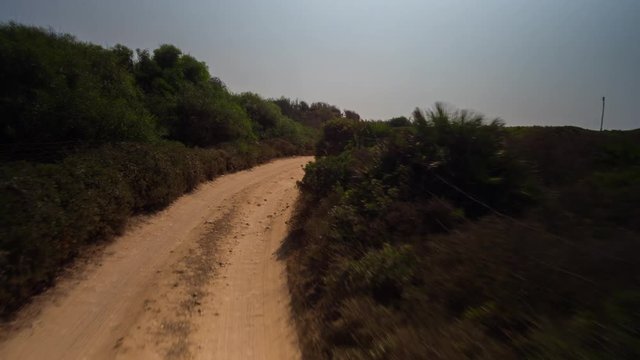 4k POV shot from a camera attached to the front of an off road vehicle driving through beautiful trails and paths in sardinia
