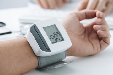 man at the doctors office with high blood pressure