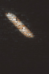 Clay brick wall with light streak - wall pattern