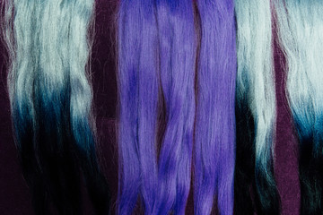 Set of locks different purple hair color samples. Braiding with synthetic purple color kanekalon.