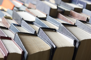 Stack of books background. many books piles.
