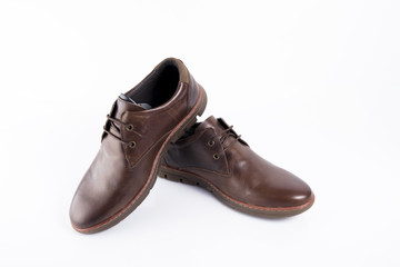 Male brown leather shoe on white background, isolated product, comfortable footwear.