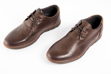 Male brown leather shoe on white background, isolated product, comfortable footwear.