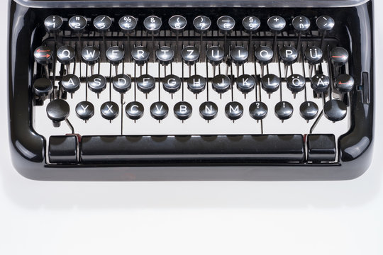 Closeup old black typewriter keyboard, vintage antique style typewriter