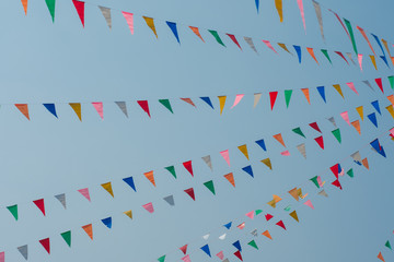 Obraz premium Colorful bunting flags with blue sky 