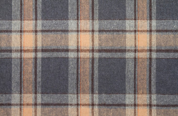 Flannel, cotton into the classic scottish cell as textile background in vintage style .