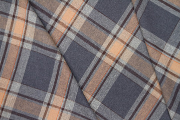Flannel, cotton into the classic scottish cell as textile background in vintage style .