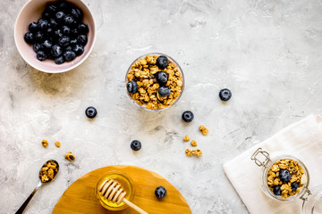 Oat flakes with honey and berries on table background top view