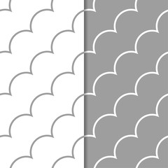Gray and white geometric ornaments. Set of seamless patterns