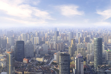 Fototapeta na wymiar aerial view of Shanghai cityscape and modern skyscraper city in misty sky background behind pollution haze, in Shanghai, China.