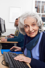 Portrait Of Senior Woman Attending Computer Class