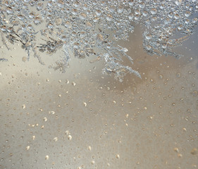 Background with silver frost on window
