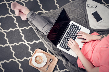 Young creative woman working with laptop