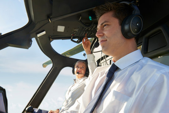 Pilot And Co Pilot In Cockpit Of Helicopter
