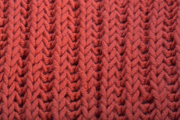 Texture of a knitted wool product, close up.