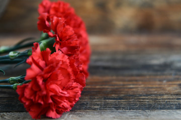 background for postcards by may 9, victory day: cap, letters, red carnations and St. George ribbon Soviet icons and old photos