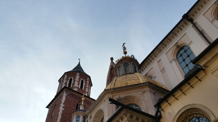 Fototapeta na wymiar Domes of two Renaissance chapels on the side of the cathedral on