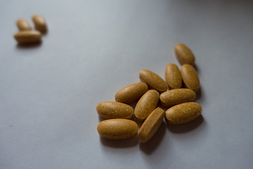 Brown pills of multivitamin complex dietary supplement