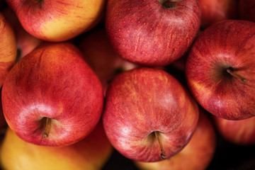 close up of red fruit apples on a wood background 