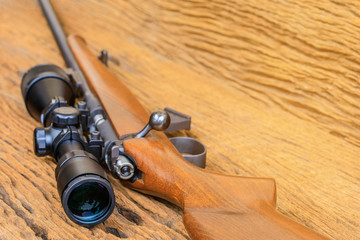 The riflescopes  on old wooden  background .