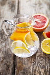 Refreshing ice cold water with lemon, kiwi and grapefruit