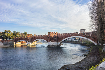 Fototapeta na wymiar View of Castel Vecchio Bridge (Ponte di Castel Vecchio or Ponte Scaligero, 1354 - 1356) - fortified bridge over the Adige River in Verona, Italy.