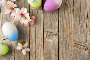 Obraz na płótnie Canvas Easter eggs, Almond flowers on old wooden table