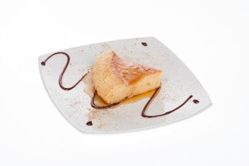 dessert portion of cheesecake served with caramel