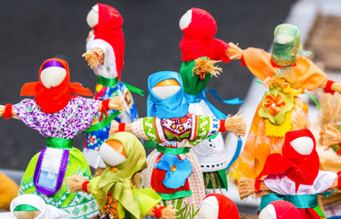 Traditional handmade straw dolls gift on the Shrovetide carnival. Maslenitsa or Pancake Week in the Russia