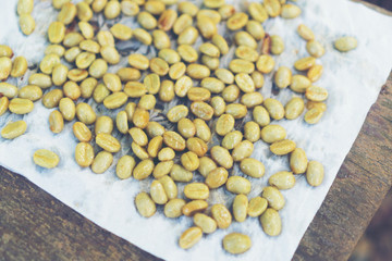 Red cherry coffee beans drying in the sun