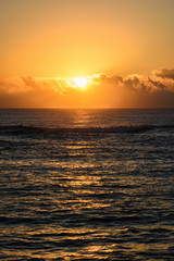 Obraz premium Golden sunrise or sunset over the sea. Vertical layout.
