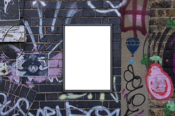 Blank notice advertising poster for mockup on painted graffiti covered brick wall