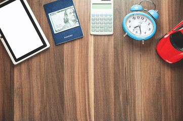 Travel accessories on the wood background.