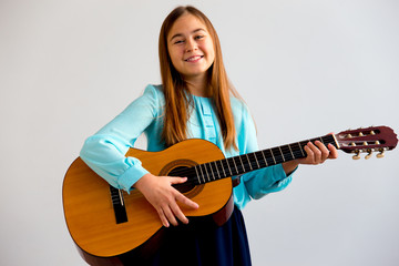 Fototapeta premium Girl playing guitar